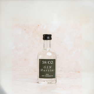 Small bottle of 58 and Co Mini Gin Martini on a light background
