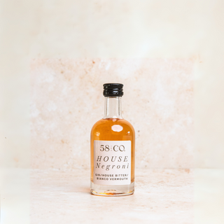 Bottle of 58 and CO. mini House Negroni on a light background