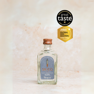 Bottle of 58 and CO Navy Strength Gin Miniature Bottle | Mini Spirit 5cl with 'Great Taste' and 'Global Gin Masters' awards on a light background