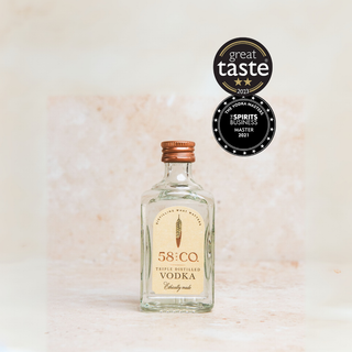Bottle of 58 and CO Triple Distilled British Vodka Miniature Bottle | Mini Spirit 5cl with awards on a light background