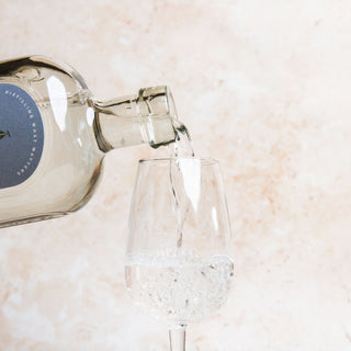 58 AND CO NAVY STRENGTH GIN being poured into a glass on a neutral background