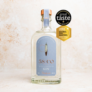 Bottle of 58 AND CO NAVY STRENGTH Gin with awards on a light background