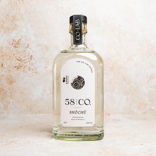 Bottle of 58 and CO British Shōchū - KASU 2021  on a textured beige background