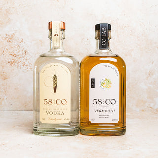 Two bottles of 58 and CO Vodka and Vermouth on a light background - Wet Martini collection