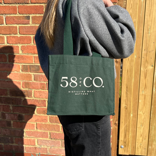 58 and CO Mini Bottle Tote Bag being modelled worn over the shoulder