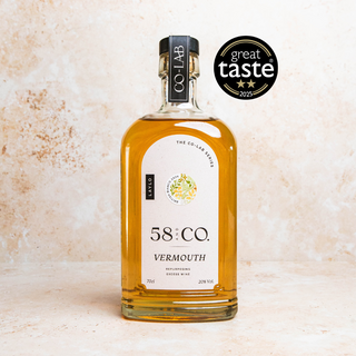 Bottle of 58 and CO British Bianco Vermouth 2024 | CO-LAB Series with Laylo | English Vermouth | White Vermouth with a 'Great Taste' award badge on a textured beige background