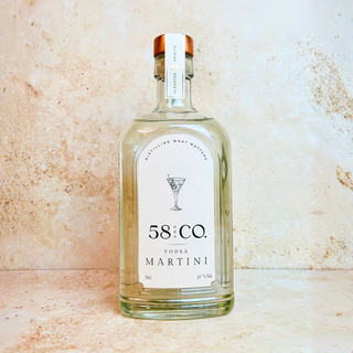 Bottle of 58 Co. Vodka Martini on a textured beige background