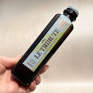 Le Tribute Olive Lemonade bottle close up