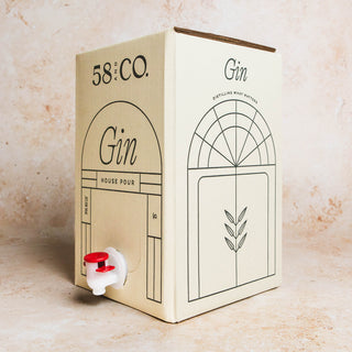 Side angle 58 and CO House Pour Gin 5L BIB on a textured surface
