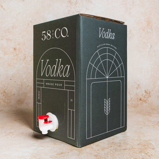 Side angle 58 and CO House Pour Vodka 5L BIB on a textured surface
