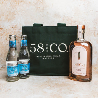 Pink gin gift set - Two bottles of Fever-Tree tonic water, a green tote bag with '58 CO.' branding, and a bottle of 58 CO apple & hibiscus pink gin