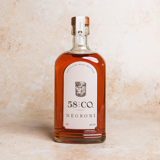 Bottle of 58 AND Co. Negroni on a beige background