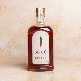 Bottle of 58 and CO British Red Bitter on a beige background