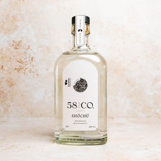 Bottle of 58 & Co Kasu Shochu on a textured beige background