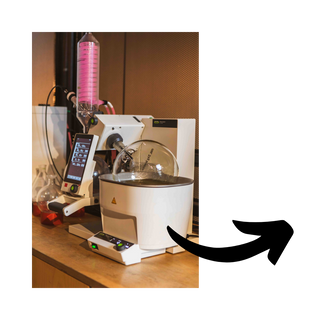 Rotavap on a wooden surface.