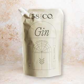 58 and CO House Pour Gin refill pouch on a textured beige background