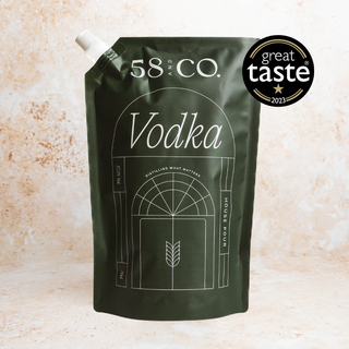 Refill pouch of 58 and Co. House Pour Vodka with Great Taste award on a beige background