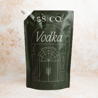 Refill pouch of 58 and Co. House Pour Vodka with Great Taste award on a beige background