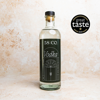 Bottle of 58 and CO Vodka with a 'Great Taste' award logo on a textured beige background