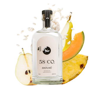 Bottle of 58 & Co. TORI shochu with fruit slices on a white background