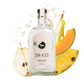 Bottle of 58 & Co tori shochu with fruit slices on a white background