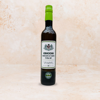 Bottle of cocchi extra dry vermouth on a neutral background