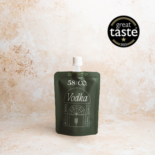 Mini travel pouch of 58 and Co House Pour Vodka with 'Great Taste' award logo on a beige background