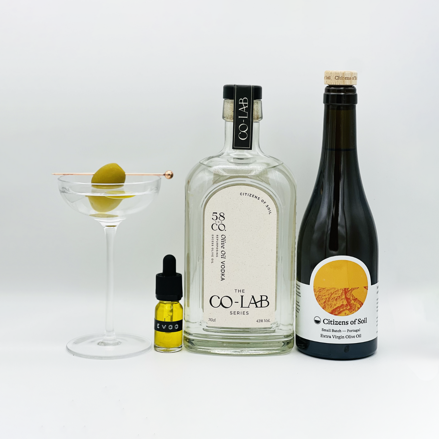 Olive Oil Vodka Martini, small bottle of extra virgin olive oil, bottle of 58 and CO CO-LAB Olive Oil Vodka and bottle of Citizens of Soil olive oil